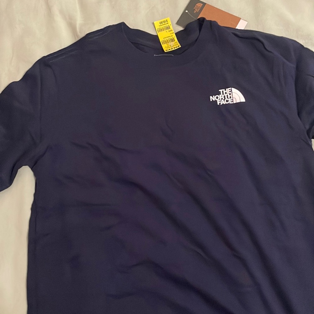 Brand new never worn North Face tees.